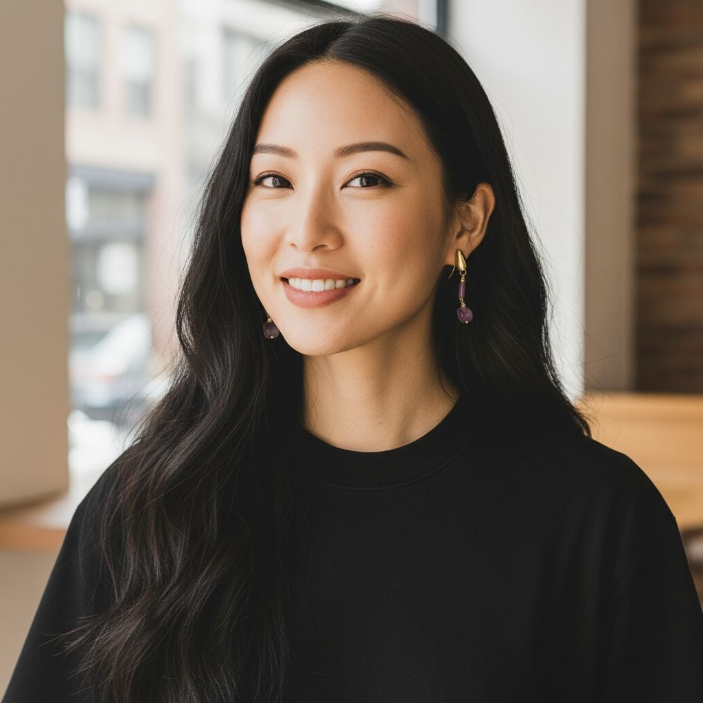 Woman wearing 925 sterling silver dangle earrings with amethyst beads