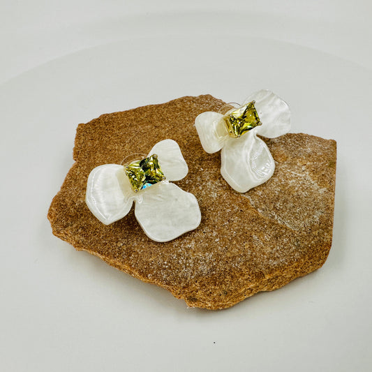 White resin floral stud earrings with square yellow zirconia centre