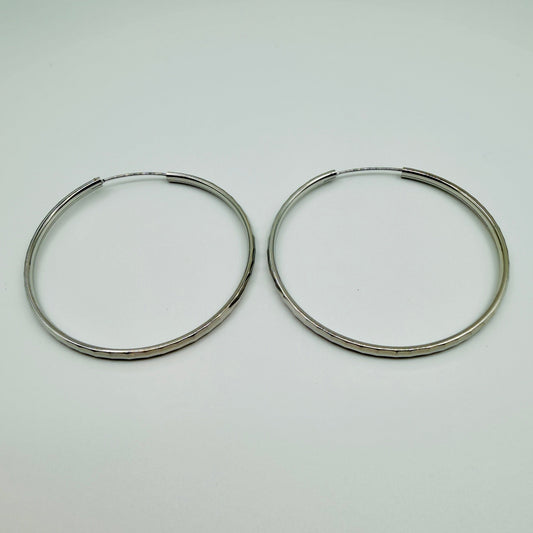 50mm sterling silver hammered hoop earrings with high-polish finish