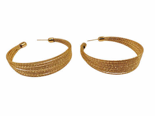 Close-up showing fine textured wire layers in gold-tone finish