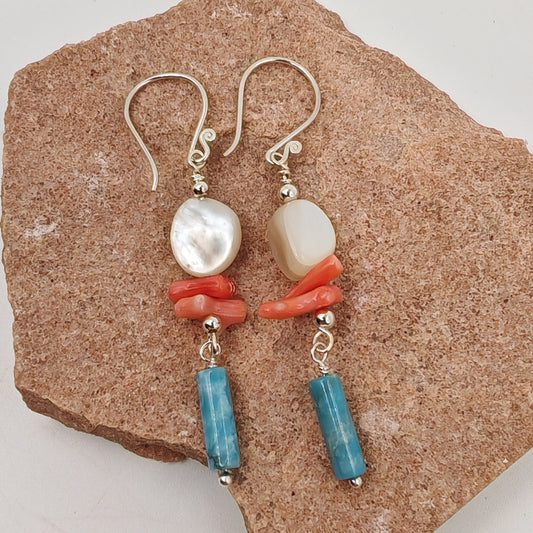 Dangle earrings with sterling silver hook, white shell, red coral, and blue agate