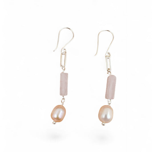 Close-up of rose quartz block and 7.5mm cultured pearl