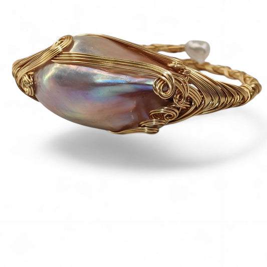 Side view of brass wire-wrapped bracelet showing depth and texture