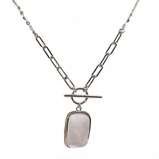 Close-up of rectangular pendant and silver casement