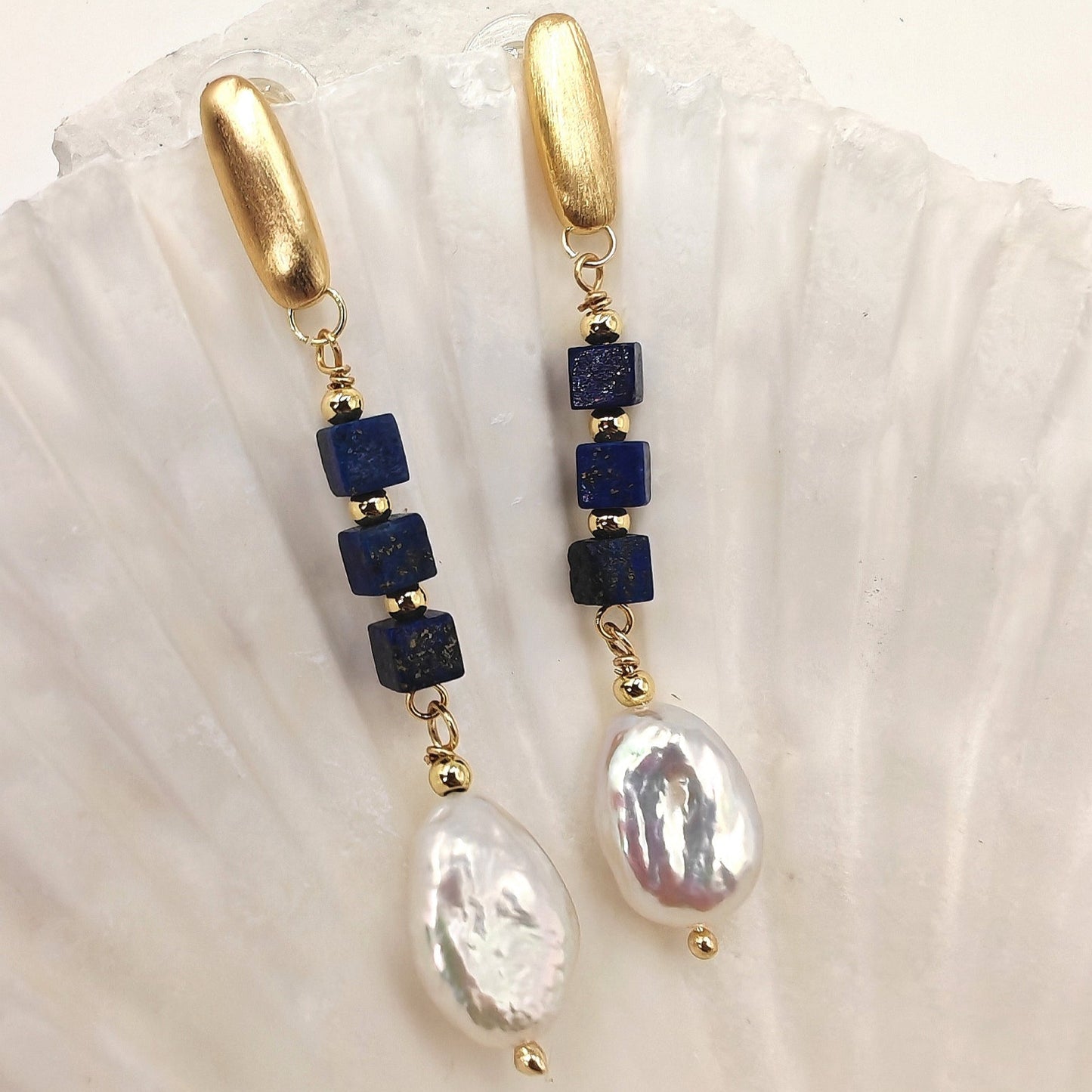Close-up of lapis cubes and baroque pearl details