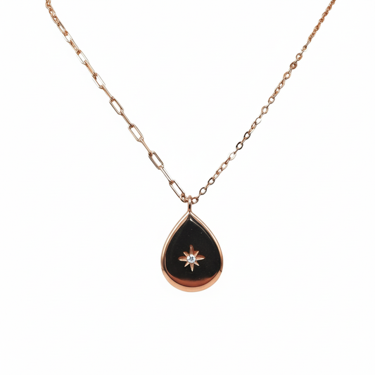 Necklace with a black teardrop pendant featuring a star design