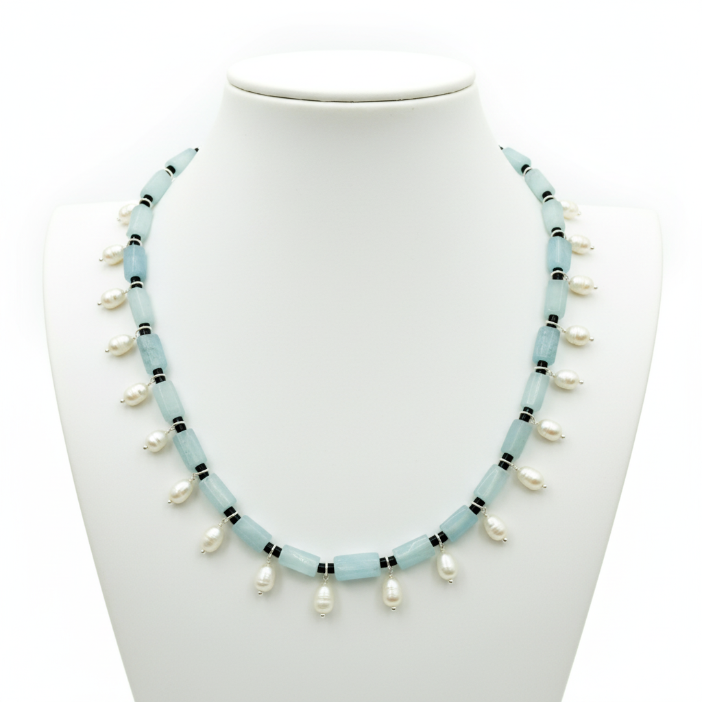 Necklace with light blue beads and white pearls on a mannequin.