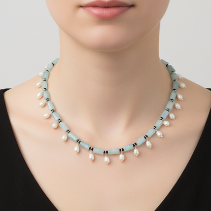 Pearl necklace on a mannequin with a plain background