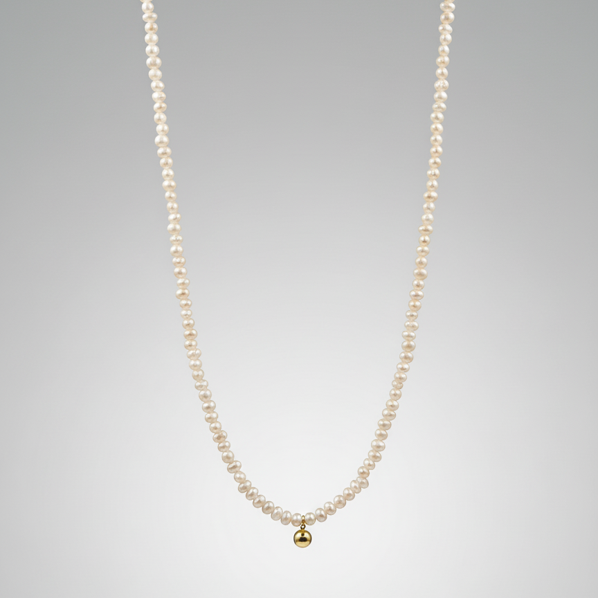 Pearl necklace with a gold pendant on a gray background