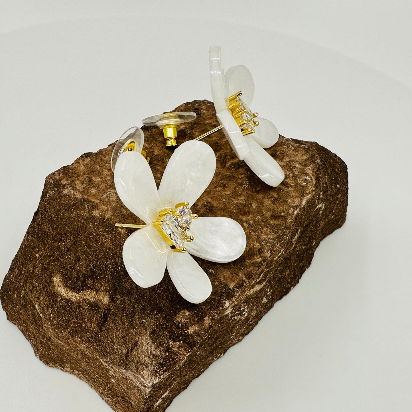 White resin iris flower stud earrings with dual zirconia centre and 925 sterling silver posts