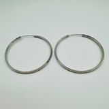 50mm sterling silver hammered hoop earrings with high-polish finish