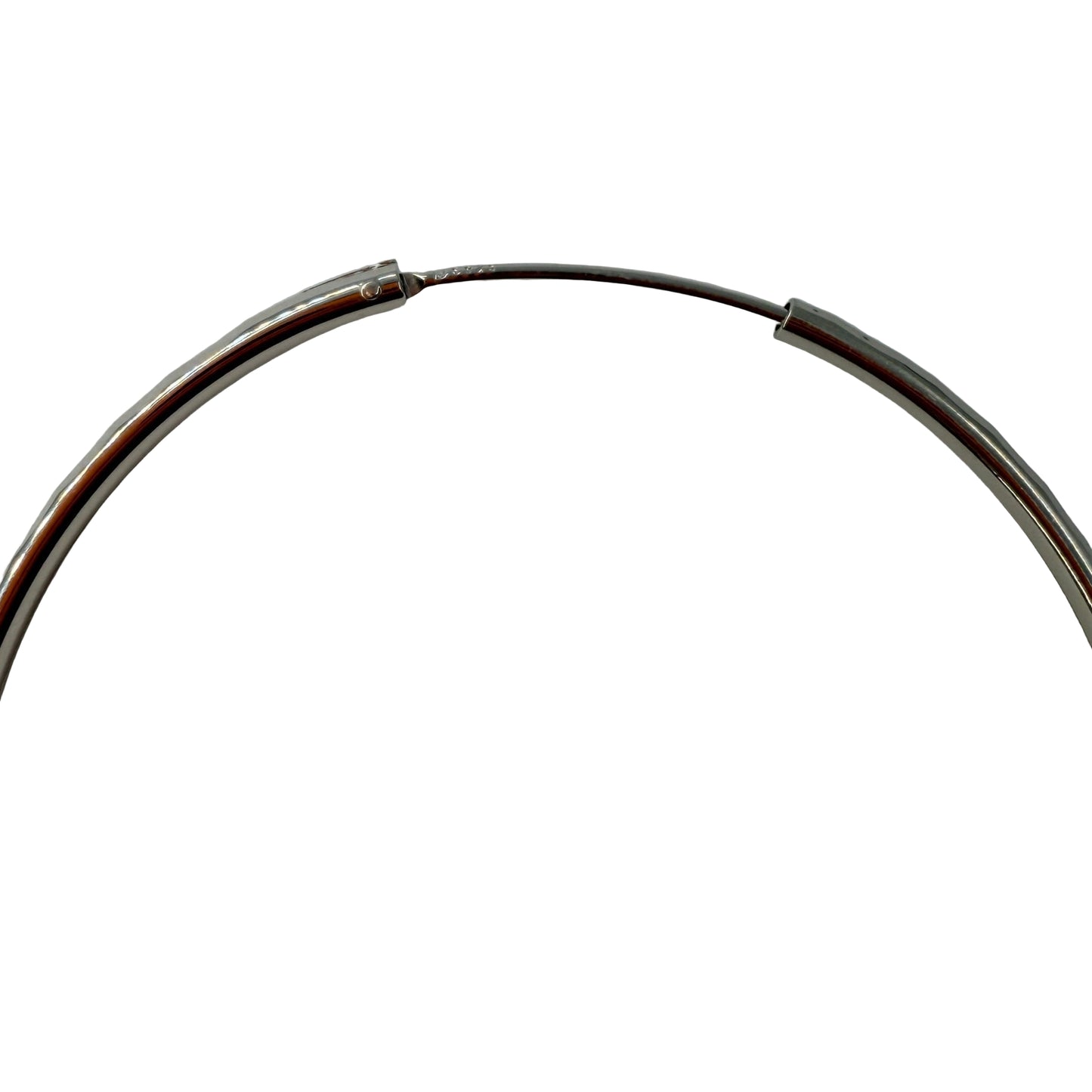 Close-up of endless closure on 50mm sterling silver hoop earrings
