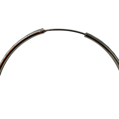 Close-up of endless closure on 50mm sterling silver hoop earrings
