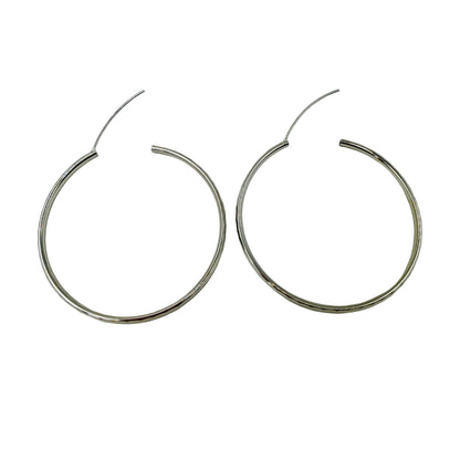 Close-up of endless closure on 30mm sterling silver hoop earrings