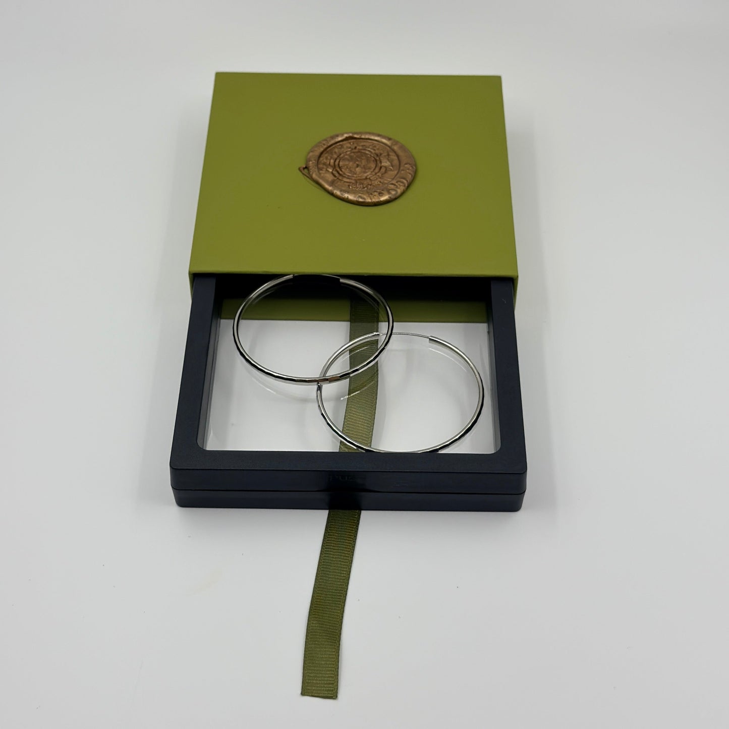 hoop earrings in Fugugemz packaging