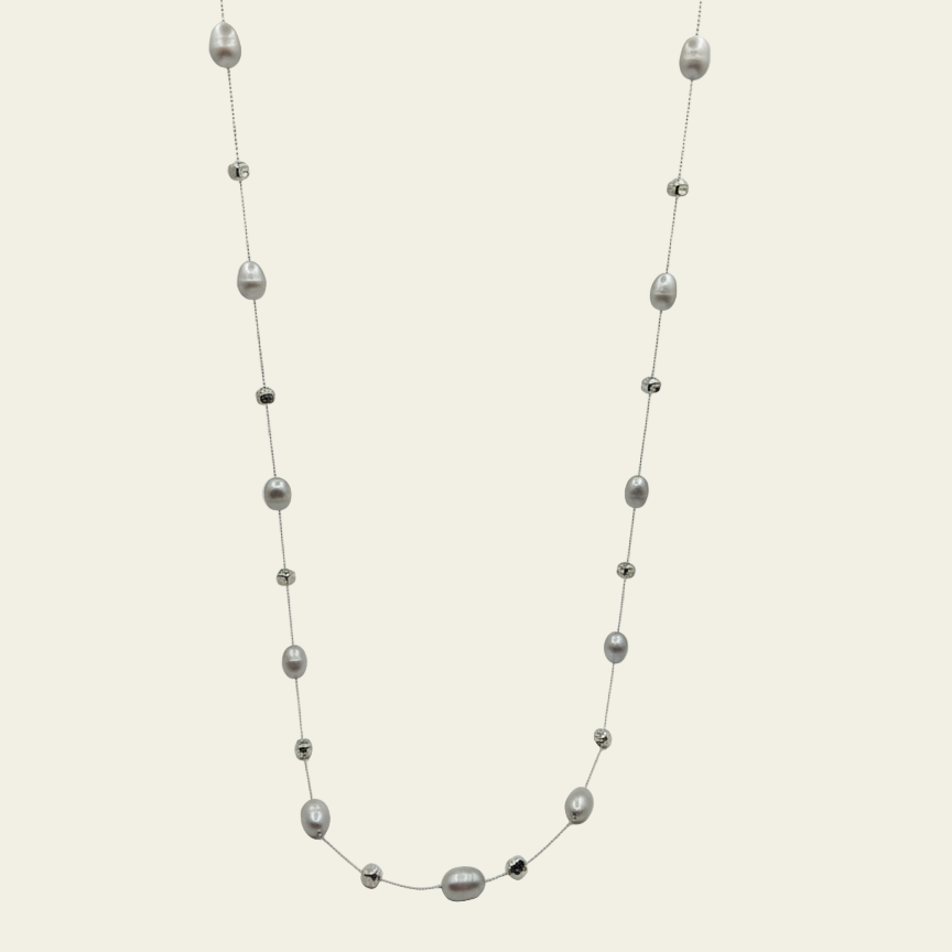 Silver beaded necklace on a white background