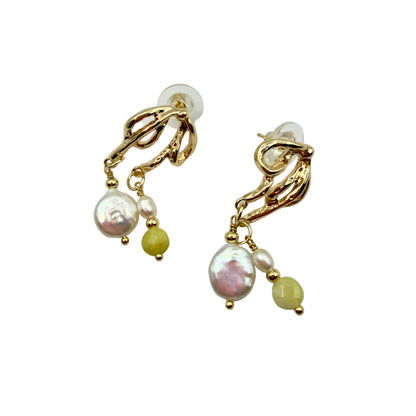 14k gold-plated dangle earrings with baroque pearl and lemon quartz on beige background
