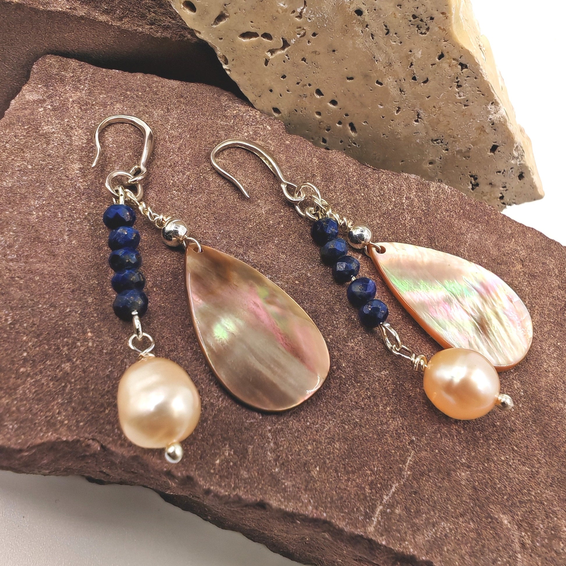 Close-up of lapis beads and iridescent teardrop shell