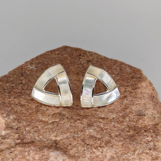 Close-up of mother of pearl texture in triangular cutout design