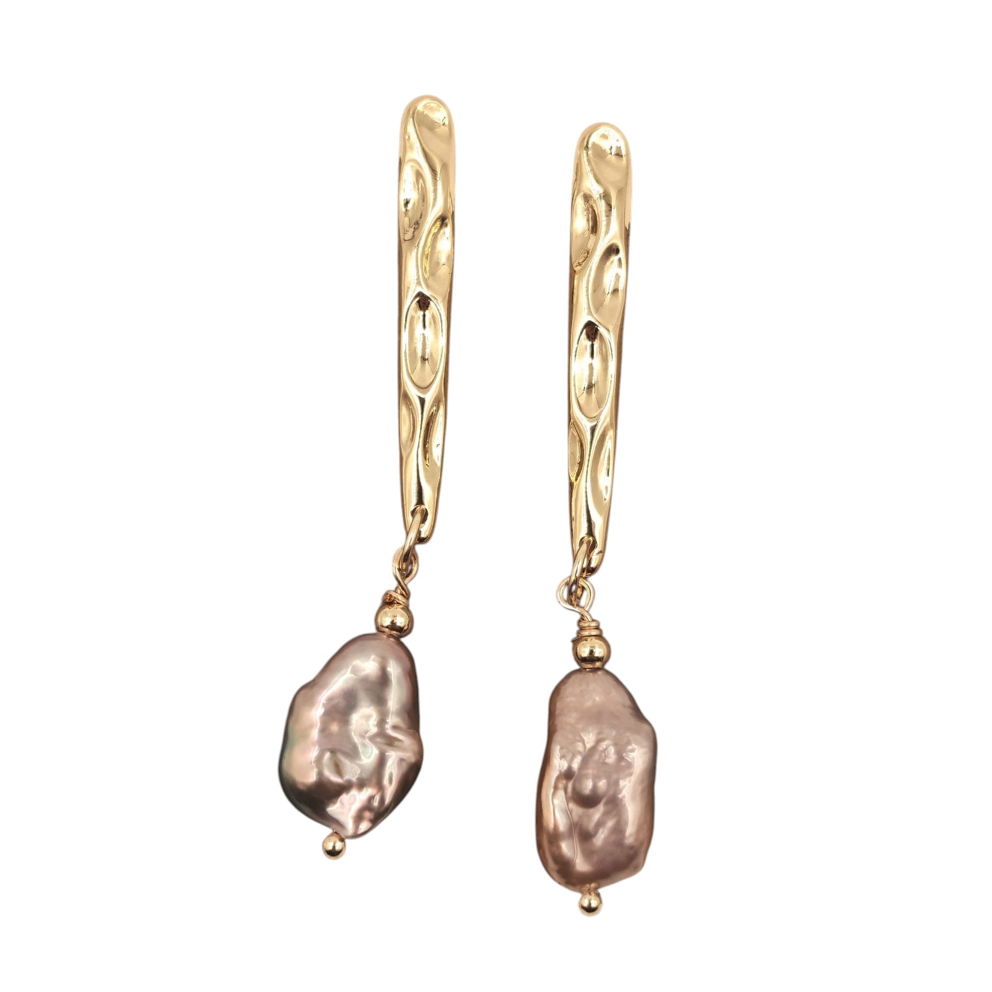 Close-up of purple baroque pearl and textured gold-plated hook