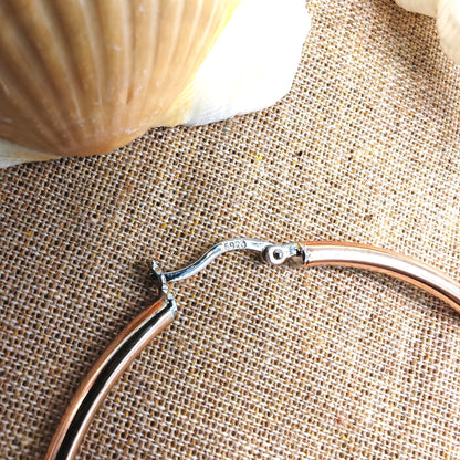 Close-up of copper-plated surface and "S925" hallmark on sterling silver clasp