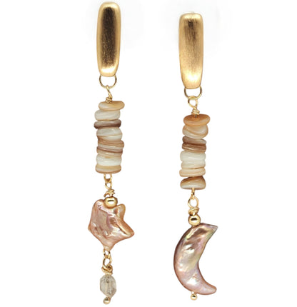 Close-up of baroque moon and star pearls, shell, and Herkimer diamond
