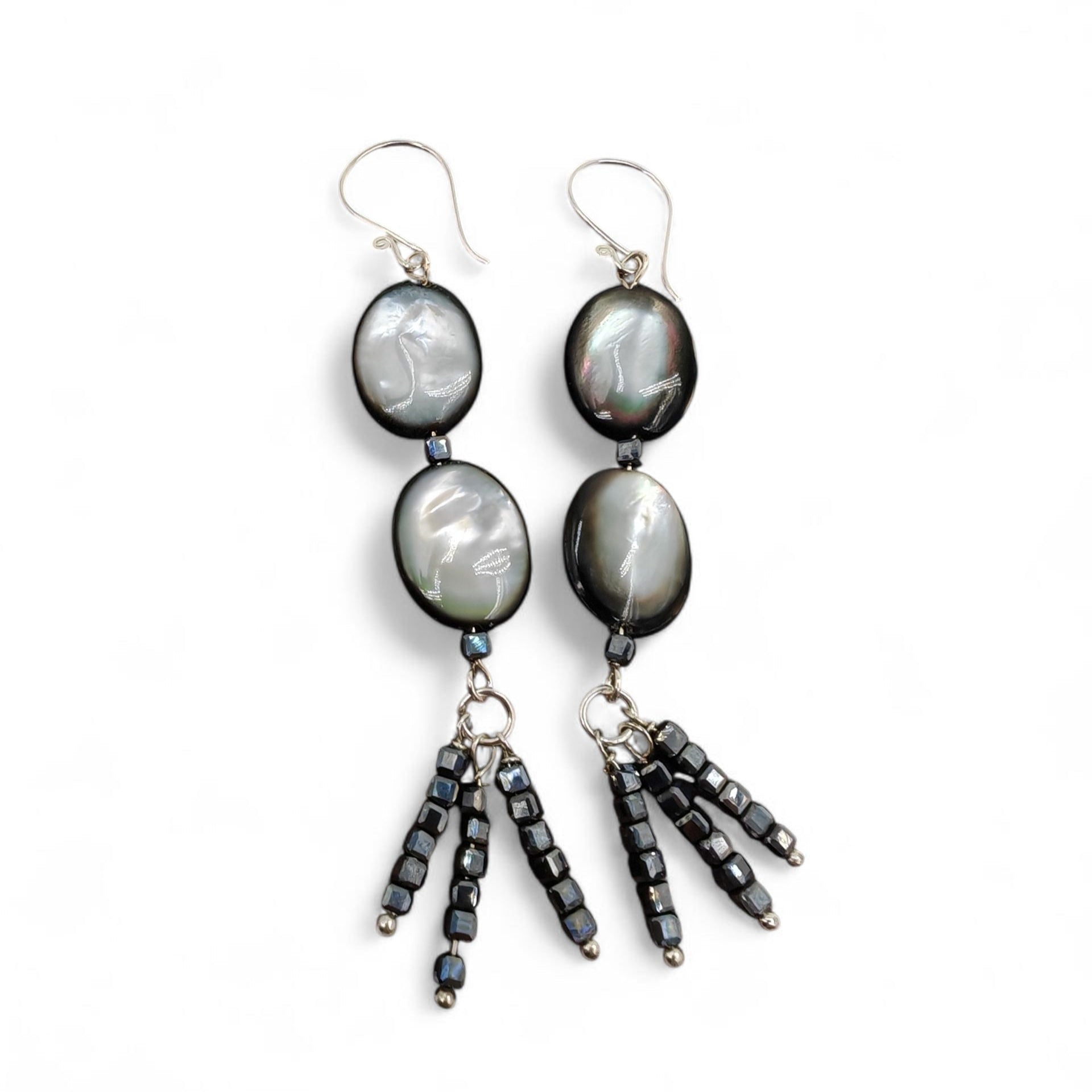 Close-up of mother-of-pearl and black spinel bead tassel