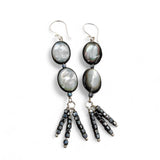 Close-up of mother-of-pearl and black spinel bead tassel