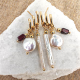 Earring with silver needle post, 14K gold-plated brass triple dangle, baroque pearls, and garnet