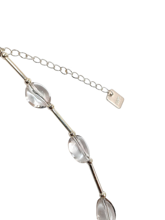 Close-up of white quartz beads and silver chain