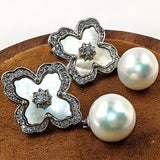 Close-up of MOP petals, zirconia centre, and 9.5mm pearl drop