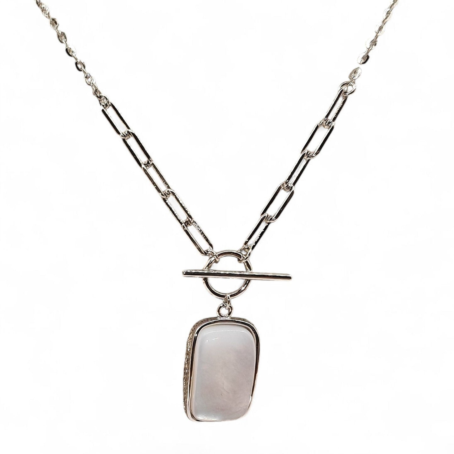 Close-up of rectangular pendant and silver casement
