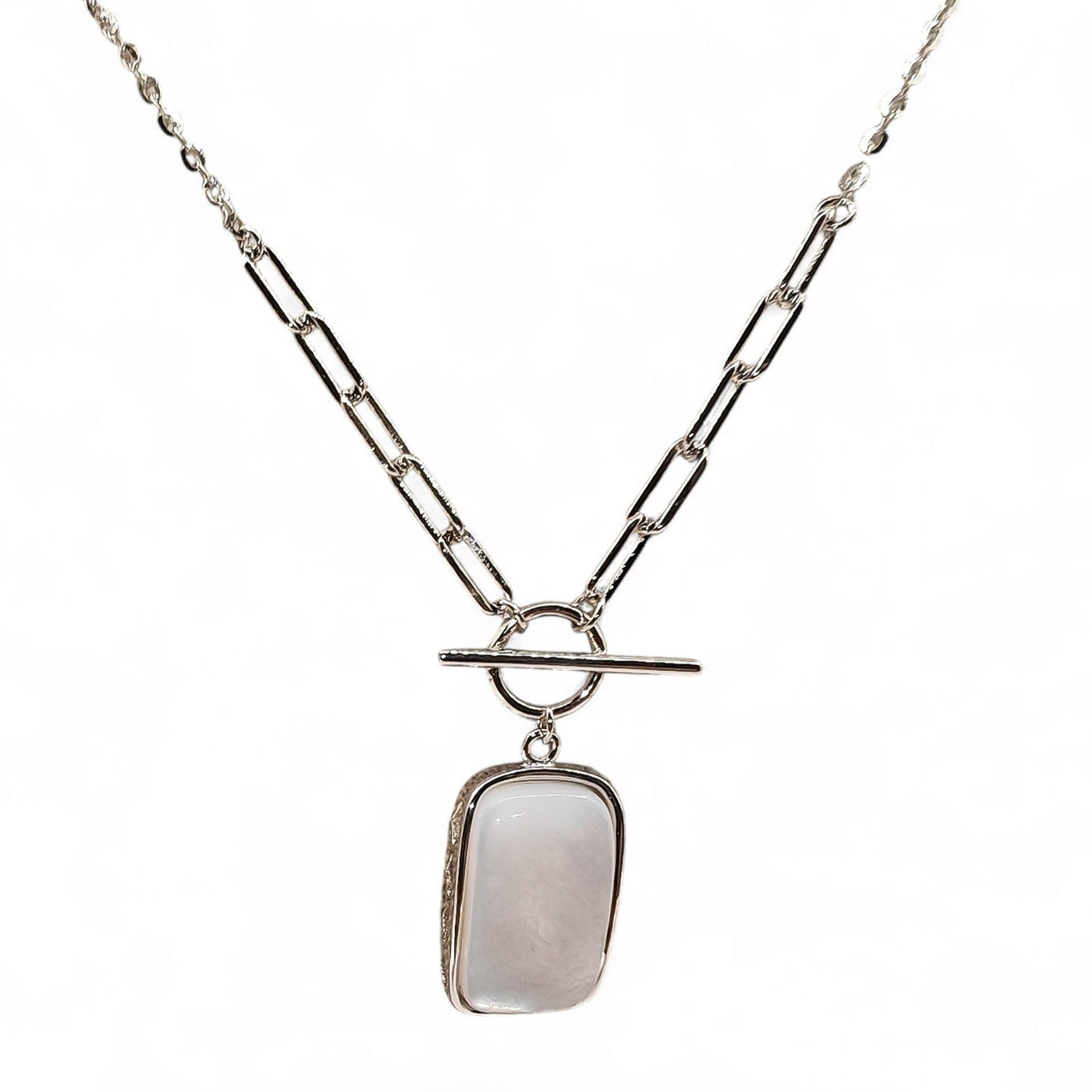 Close-up of rectangular pendant and silver casement
