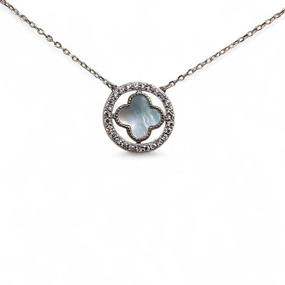 Close-up of cross pendant and zirconia halo