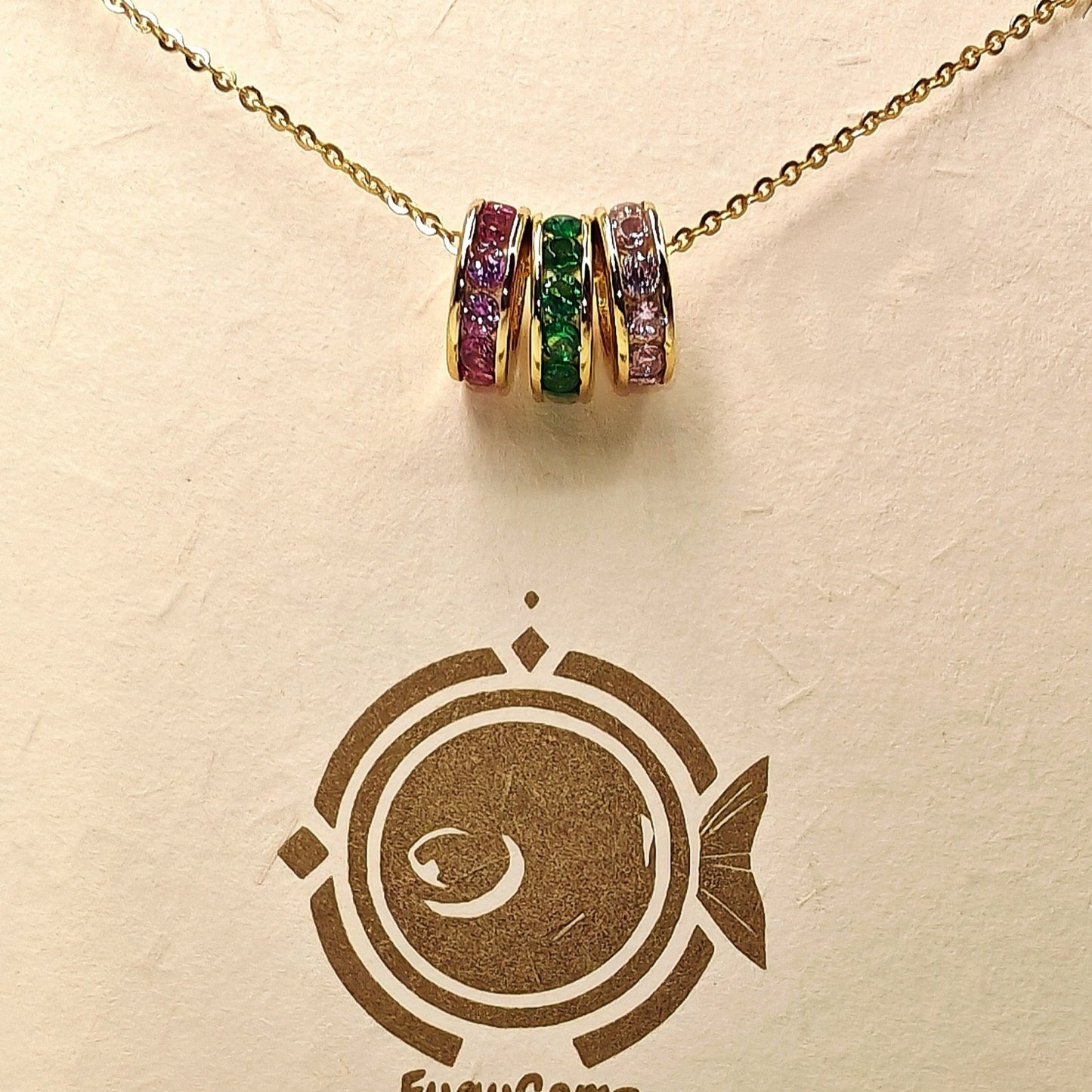 Necklace with colorful gemstones on a FuguGemz branded card