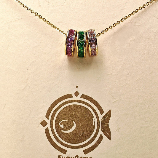 Necklace with colorful gemstones on a FuguGemz branded card