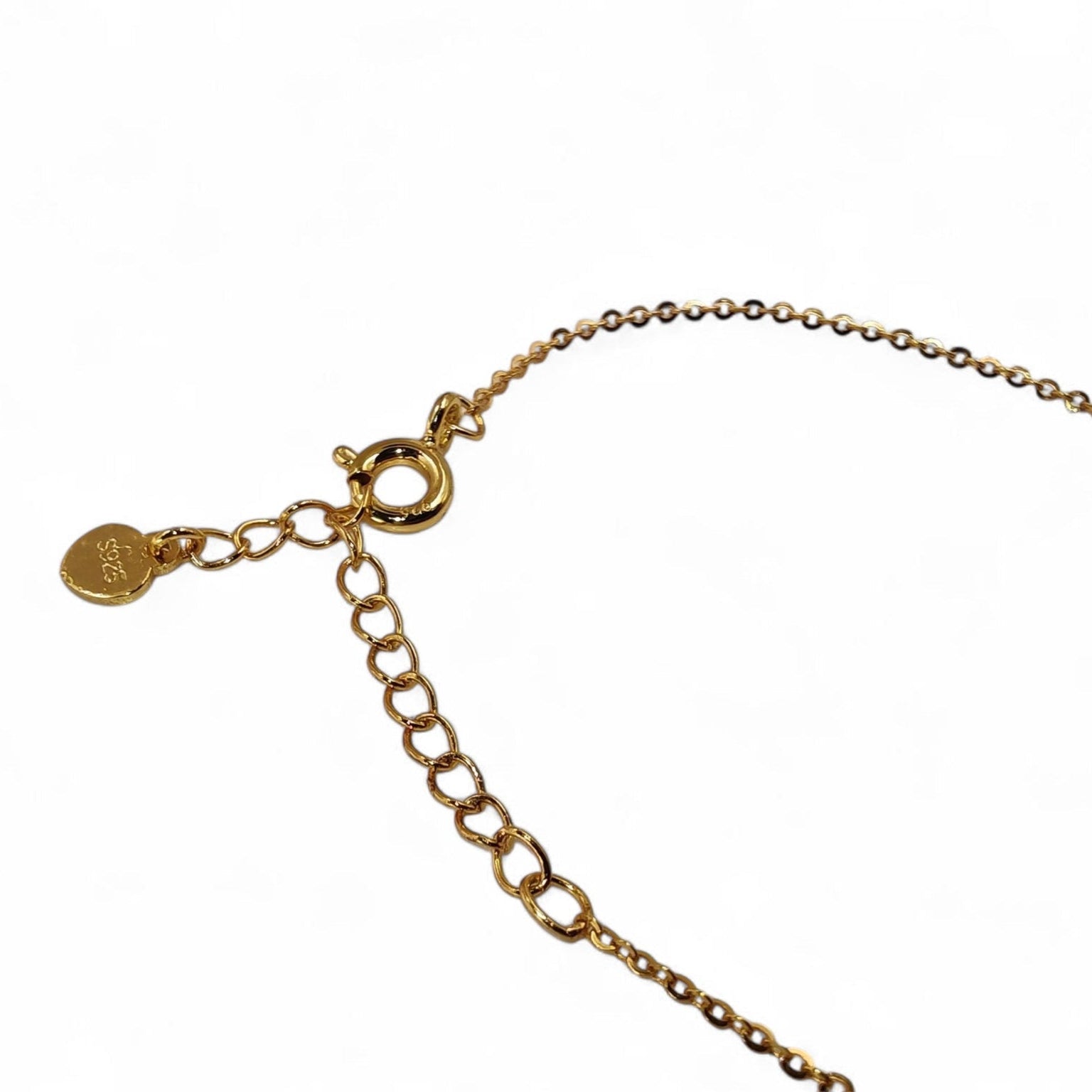 Gold bracelet on a white background showing 925