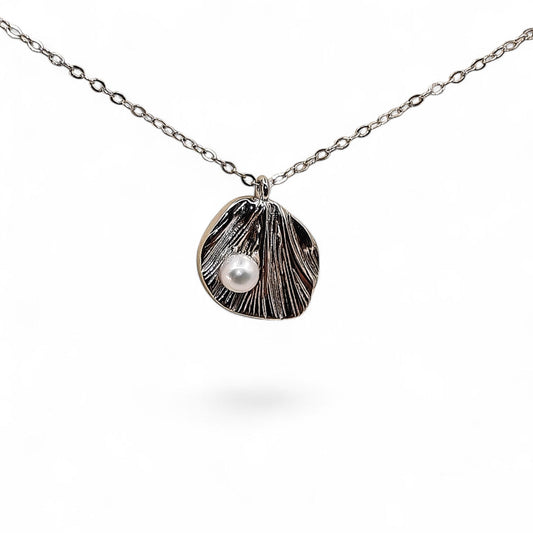 Close-up of textured silver leaf and pearl