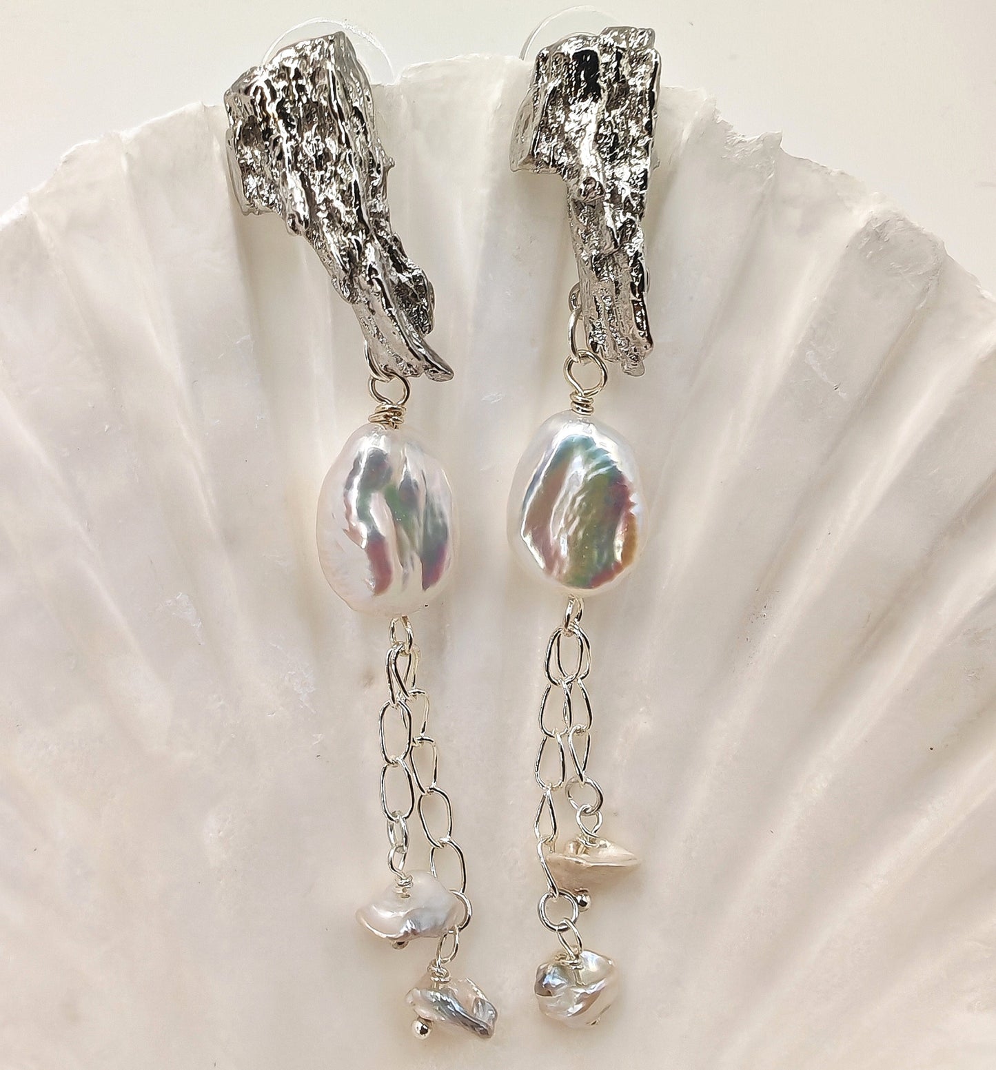 Platinum-plated dangle earrings with 16mm x 11.5mm baroque pearl and two 6.5mm pearls on 925 chain
