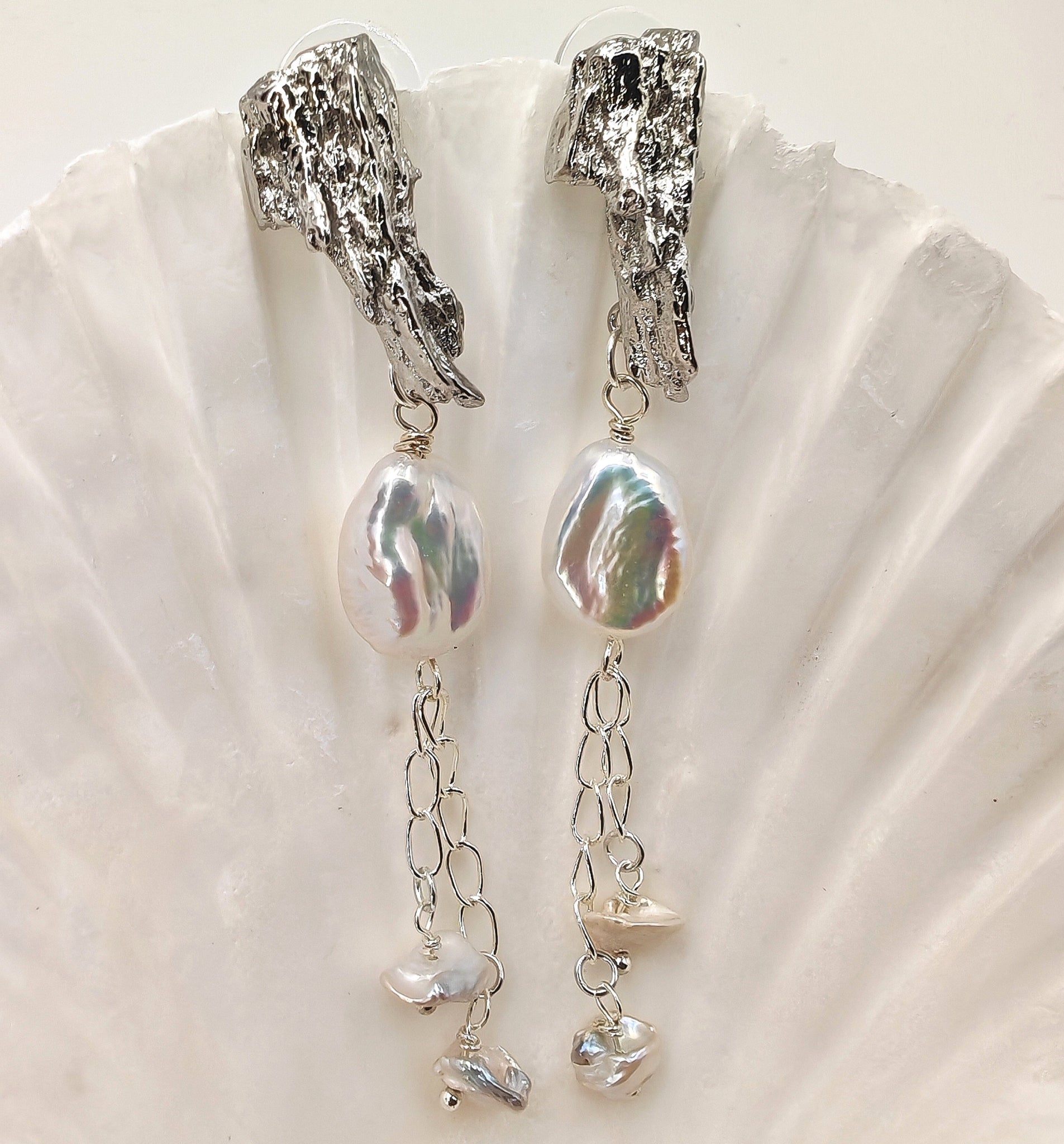 Platinum-plated dangle earrings with 16mm x 11.5mm baroque pearl and two 6.5mm pearls on 925 chain
