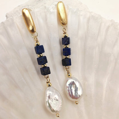 Close-up of lapis cubes and baroque pearl details
