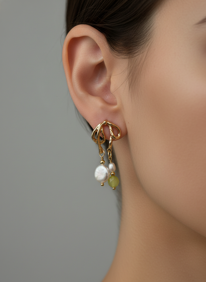 Woman wearing gold dangle earrings with baroque pearl and lemon quartz Fugugemz
