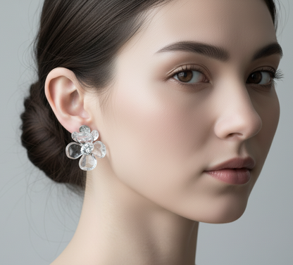 Woman wearing resin flower stud earrings with natural makeup and loose hair