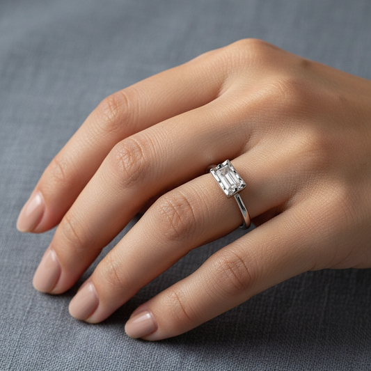 Woman wearing silver and zirconia ring on finger