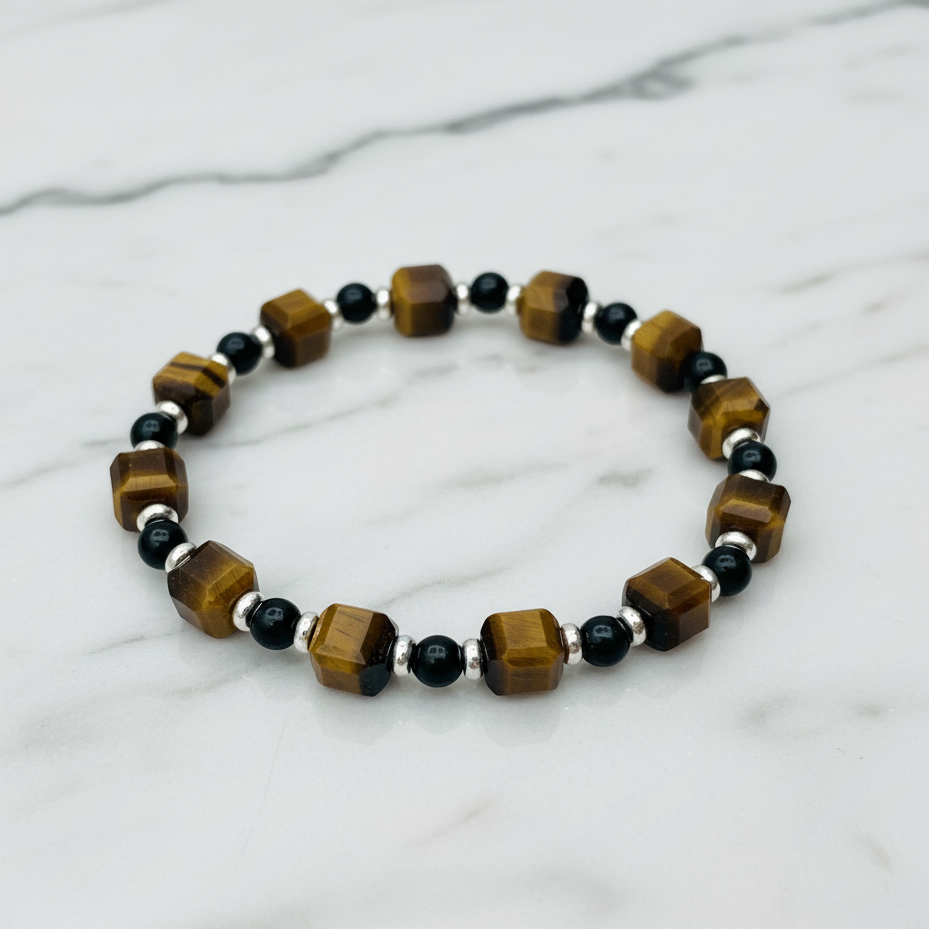 Close-up of the bracelet, highlighting the faceted 7mm tiger eye cube and the shimmering gold obsidian beads. Fugugemz