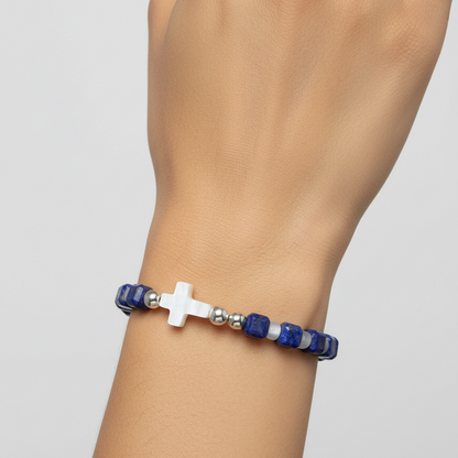 Close-up of the bracelet, highlighting the mother of pearl cross and the lapis beads. fugugemz