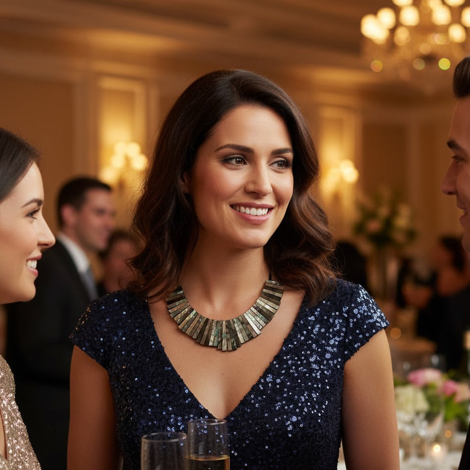 Woman wearing mother of pearl segment necklace with black dress