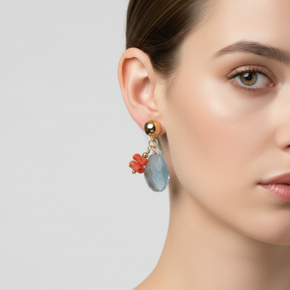 Close-up of a woman wearing an earring with colorful beads on a plain background