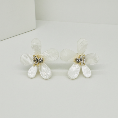 Close-up of marquise and round zirconia stones in gold-tone prong setting