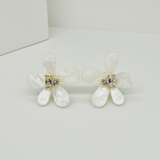 Close-up of marquise and round zirconia stones in gold-tone prong setting